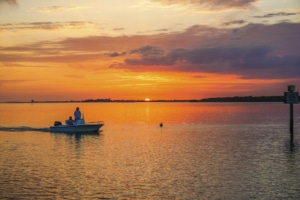 sunset with boat on Sanibel Island