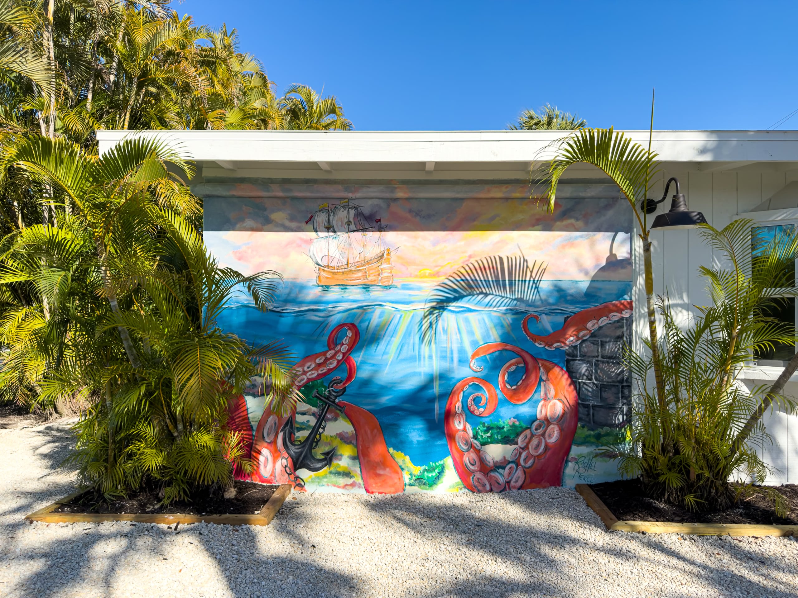 Colorful nautical mural at the renovated Anchor Inn & Cottages on Sanibel Island featuring octopus, sailboat, and underwater scene.